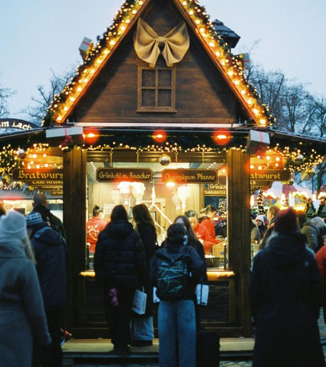 A festive scene at Berlin's Christmas market with people enjoying holiday cheer.